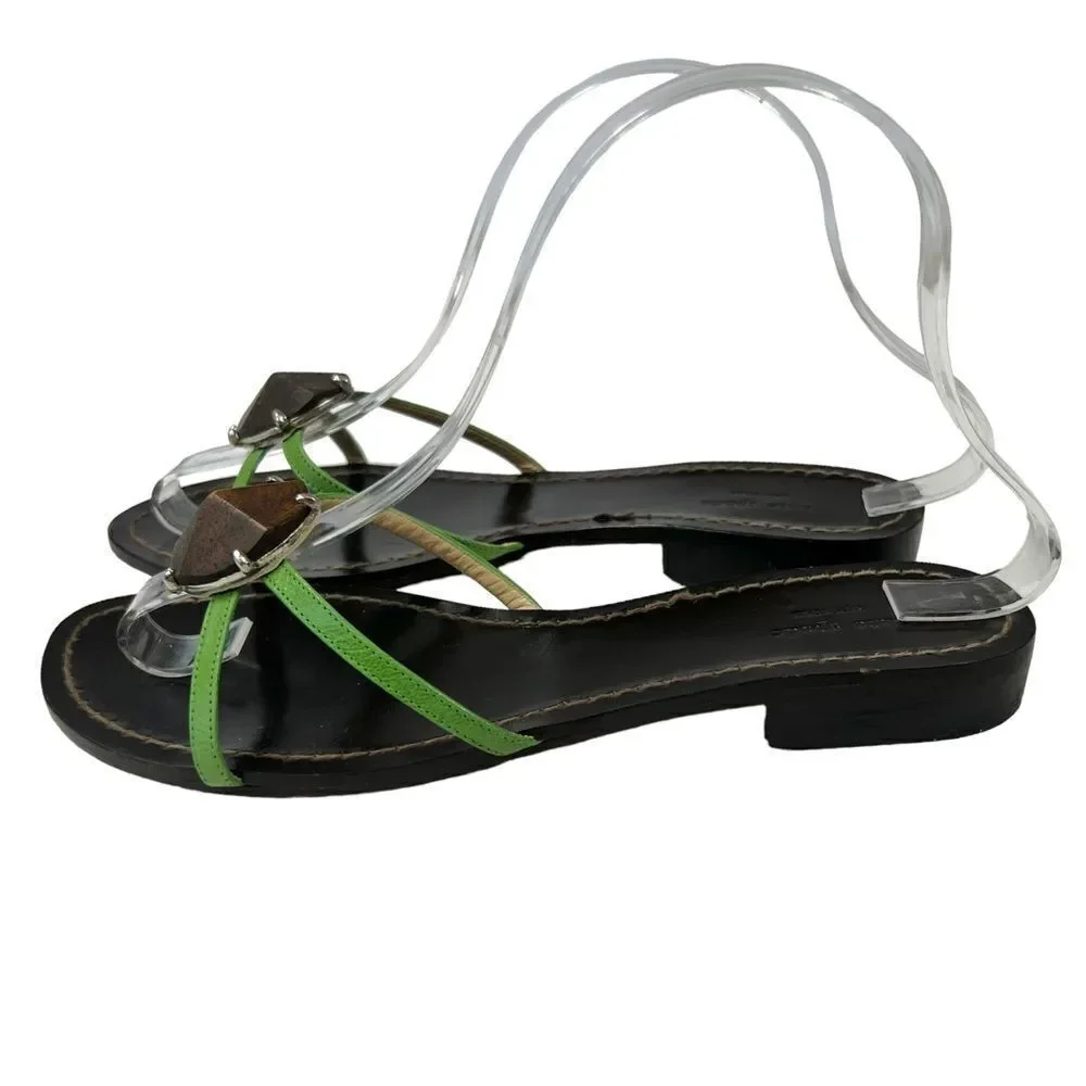 Kate Spade Green Leather Flat Sandals with wooden center ornament.